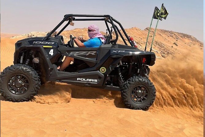 1 Hour Private Self Drive Dune Buggy and Sand boarding in Dubai - Driving a Polaris RZR across Dubai’s red dunes