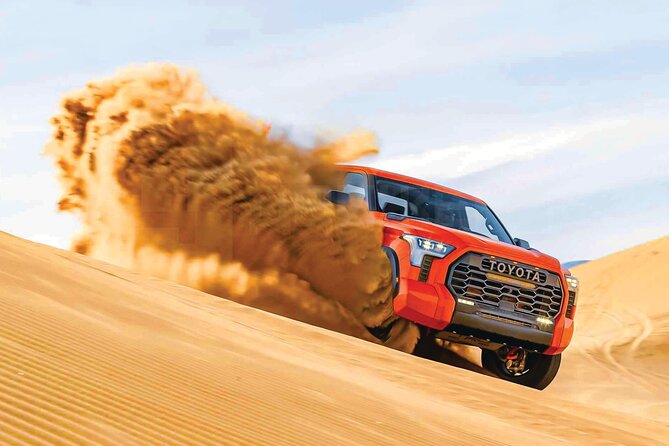 4 Hour Morning Desert Safari with Camel Ride & Sand Boarding - Dune bashing across the high red dunes