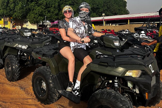 4 Hours Desert Tour with Quad Bike Camel Ride & Sandboard - Sandboarding on the dunes