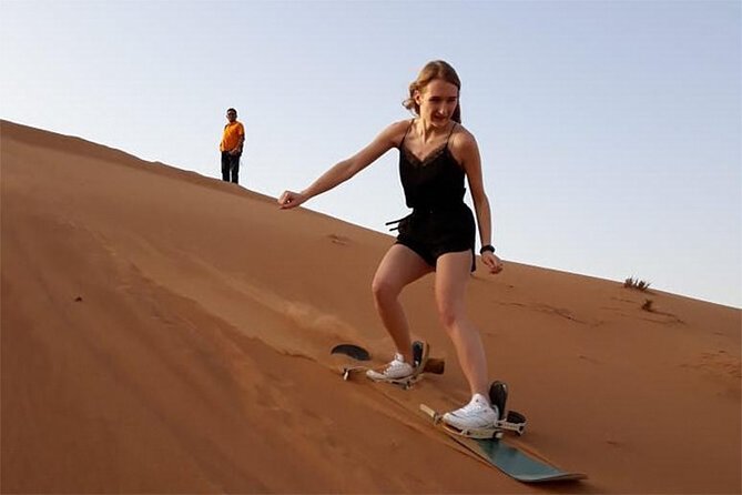 6-Hour Dubai Desert Dinner Safari with Dune Bashing & Camel Ride - Sunset, Arabic dress, and the Bedouin-style camp