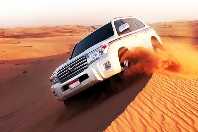 6-Hour Dubai Desert Dinner Safari with Dune Bashing & Camel Ride - Dune bashing in a 4x4