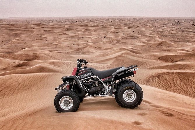 90-Minutes Quad Biking Tour From Dubai - Getting ready with helmet and gloves