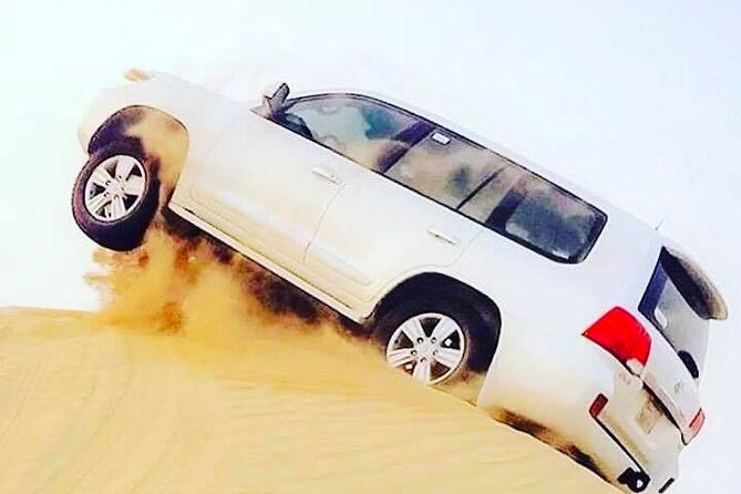 Abu Dhabi: 7-Hours Desert Safari with BBQ, Camel Ride & Sandboarding - BBQ dinner and live entertainment