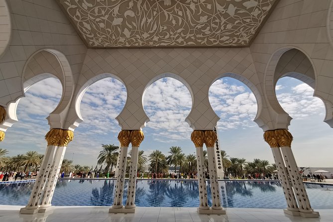 Abu Dhabi City Tour Including Ferrari World Tickets from Dubai - Abu Dhabi skyline, Corniche, Louvre, and marina views