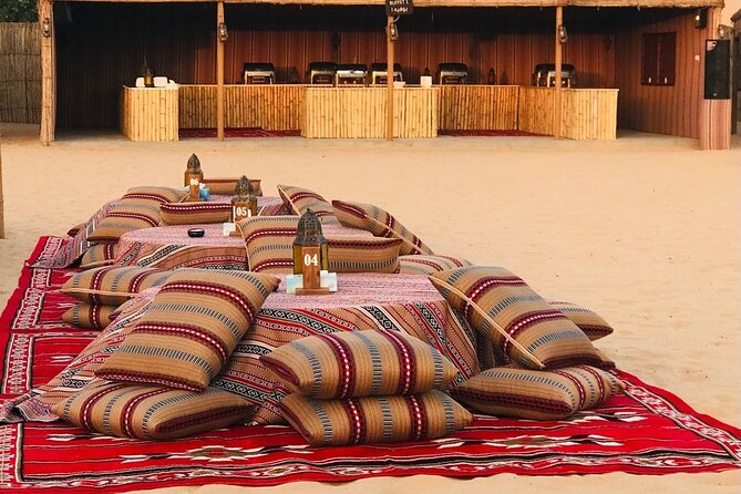 Abu Dhabi Desert safari with BBQ Dinner,Sandboarding & Camel ride - Sunset, BBQ dinner, and evening performances