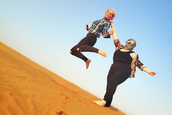 Afternoon Dune Drive Safari with SunSet Photo & Sand Boarding - Sandboarding on the red dunes
