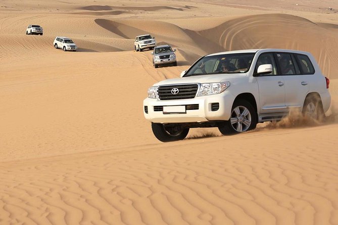 Best Dubai Desert Safari with Buffet Dinner,Sand Boarding & Shows - Lahbab’s red dunes and the main dune-bashing ride