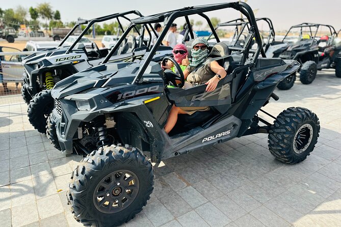 Best Dubai Desert Safari with Buffet Dinner,Sand Boarding & Shows - Sandboarding on the soft red dunes
