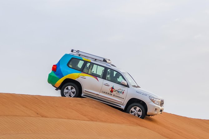 Best of Dubai : Dubai City Tour + Evening Desert Safari with all Activities - Camels, falcons, and sandboarding