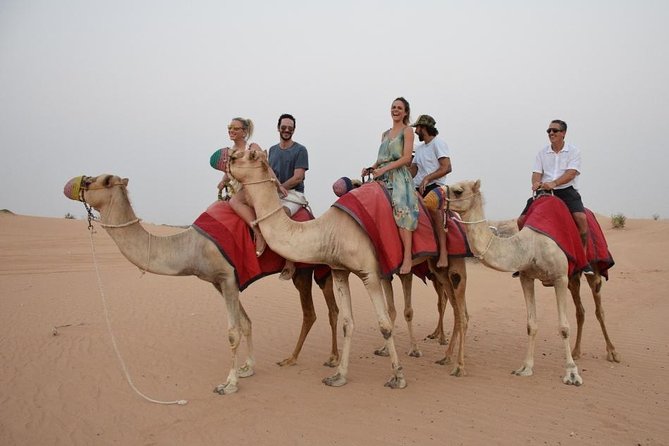 Classic Dubai Desert Safari with BBQ Dinner and Camp activities - Sunset at the desert camp