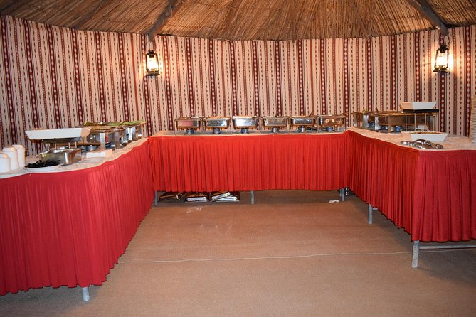 Classic Dubai Desert Safari with BBQ Dinner and Camp activities - BBQ dinner beneath the evening sky