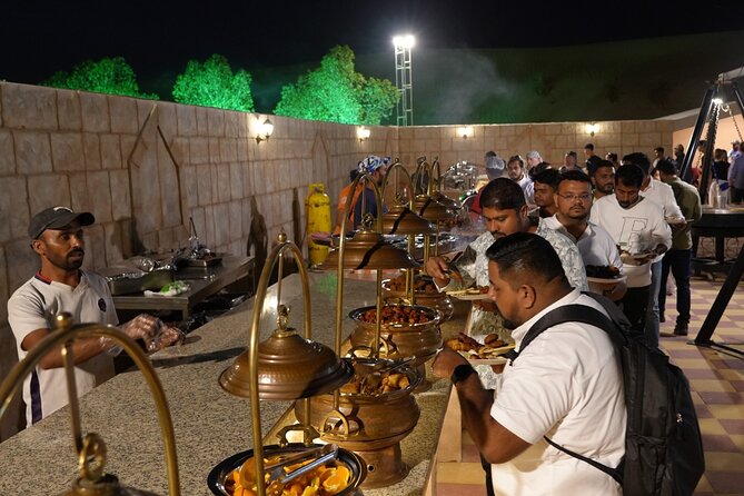 Deluxe Premium Dubai Desert Safari with Camel Ride, and Live Show - Sandboarding, camel riding, and camp activities