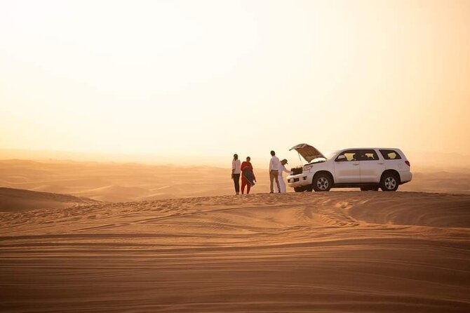 Desert Adventure with ATV and Camel Ride and Live Shows - Land Cruiser dune bashing across the red dunes