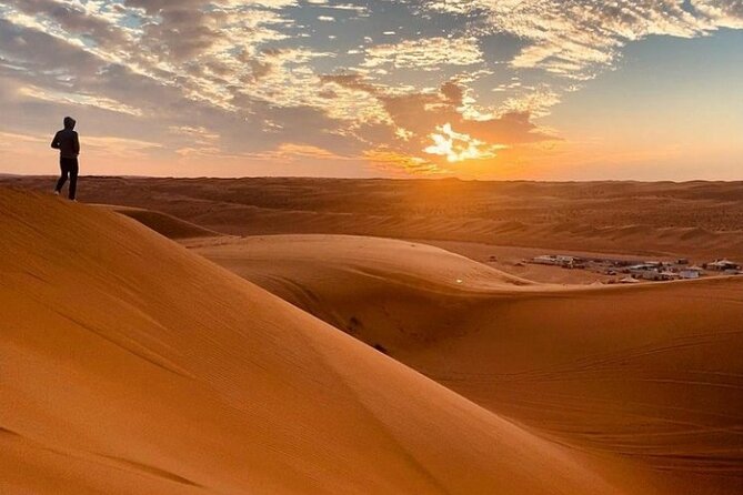 Desert Quad Biking Tour and Sand Boarding with Dinner in Dubai - BBQ Buffet, Tanura Dancing, Fire, and Belly Dance