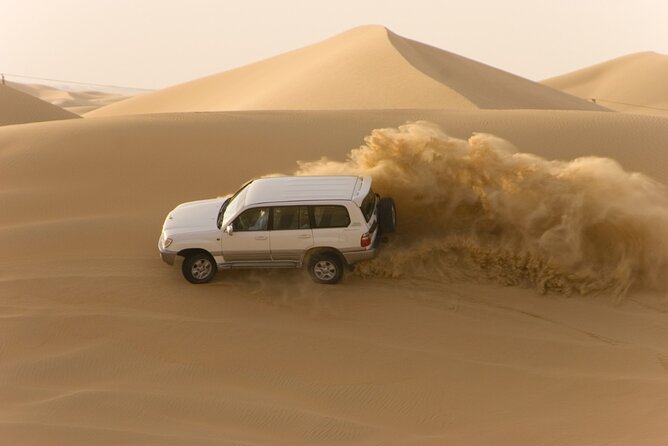Desert Safari Abu Dhabi w/ Sand Boarding, Camel Ride & BBQ Dinner - Leaving Abu Dhabi for Al Khatim