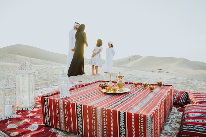 Desert Safari Abu Dhabi w/ Sand Boarding, Camel Ride & BBQ Dinner - A Bedouin-style welcome at the evening camp