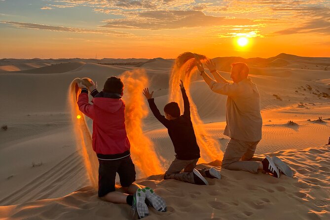 Desert Safari Abu Dhabi w/ Sand Boarding, Camel Ride & BBQ Dinner - Dune bashing across Al Khatim