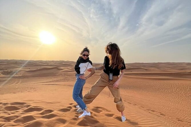 Desert Safari BBQ dinner, Camel ride & sandboarding from Dubai - Sunset Photos, Henna, and Arabic Clothing