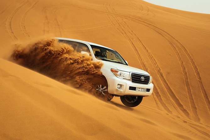 Desert Safari Dubai at Evening with BBQ Dinner - Sunset photos and sandboarding at Lahbab