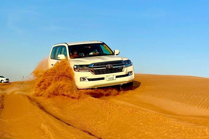 Desert Safari Dubai with BBQ Dinner & Camel Ride - Sandboarding adds a simple burst of fun