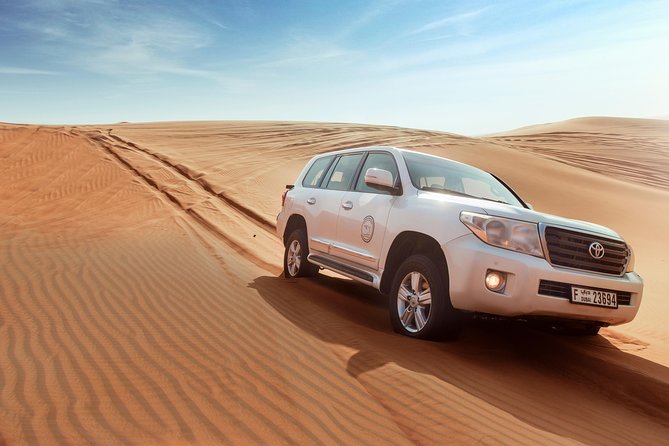 Desert Safari Dubai with Dune Bashing, Sandboarding, Camel Ride, 5 Shows, Dinner - Sunset photos are worth protecting