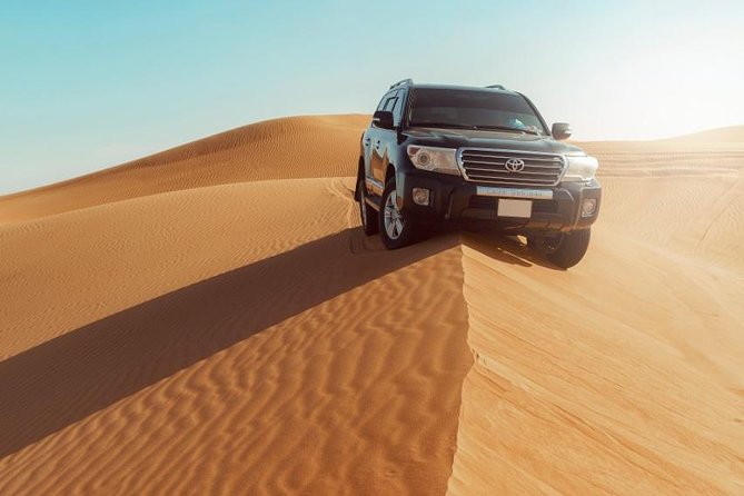 Desert Safari Dubai with Dune Bashing, Sandboarding, Camel Ride, 5 Shows, Dinner - Sandboarding and camel riding keep the program varied