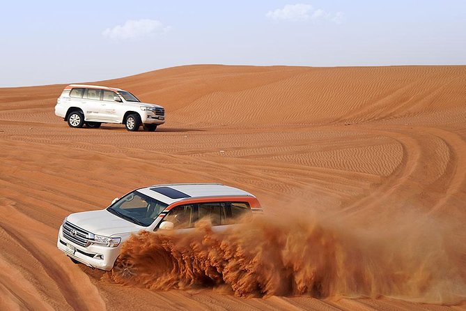Desert Safari in 4X4 through Lahbab Desert with BBQ Dinner - Camel rides, henna, and a Bedouin-style camp