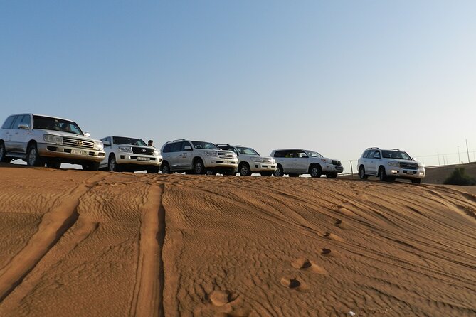 Desert Safari in Dubai Red Dunes with BBQ VEG Dinner - Sunset photos on the red sand