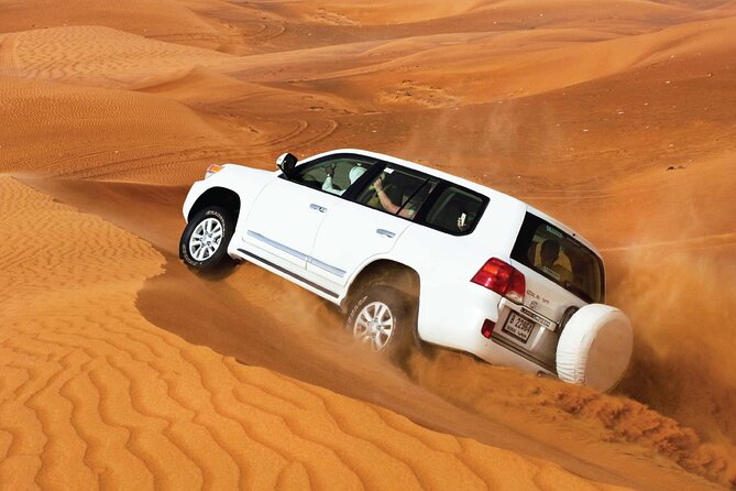 Desert Safari Redsand Dunes with BBQ Dinner in Dubai - Dune bashing in a Toyota Land Cruiser