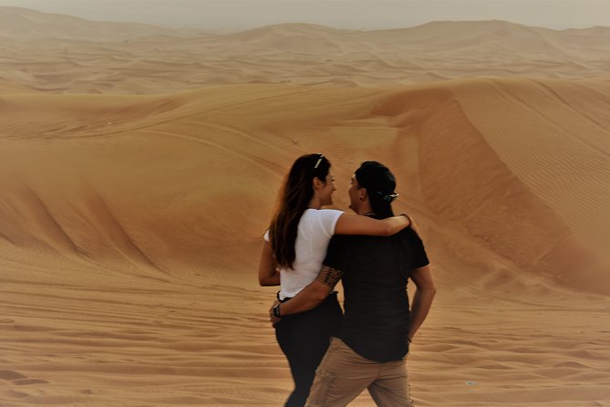 Desert Safari Tour, Quad Bike with BBQ Dinner & Show from Dubai - Sunset photographs and sandboarding