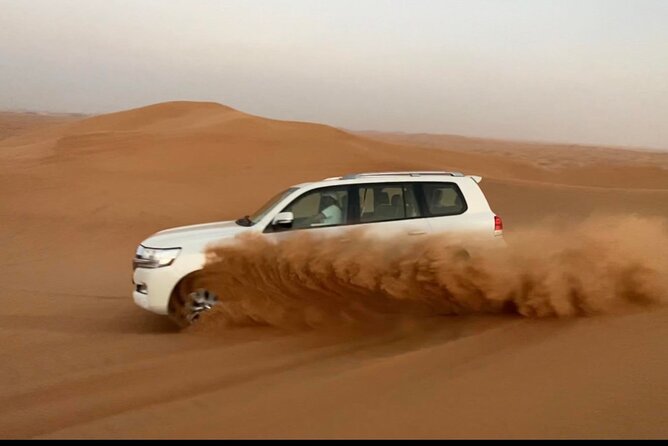 Desert Safari Tour with Camel Ride and BBQ Dinner in VIP Camp - Sandboarding and photographs in the open desert