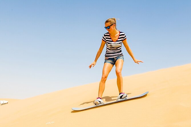 Desert Safari with BBQ Dinner, Camel Ride, Sand Board & Live Show - Leaving Dubai for the Red Dunes
