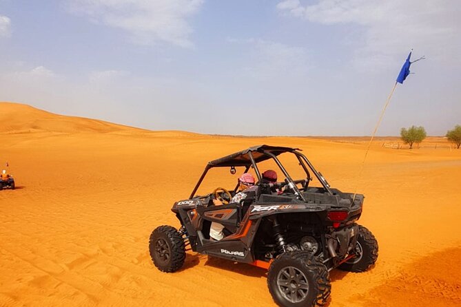 Desert Safari With BBQ Dinner, Quad Bike & Camel Ride from Dubai - Camel riding, sandboarding, falcons, and Arabic touches