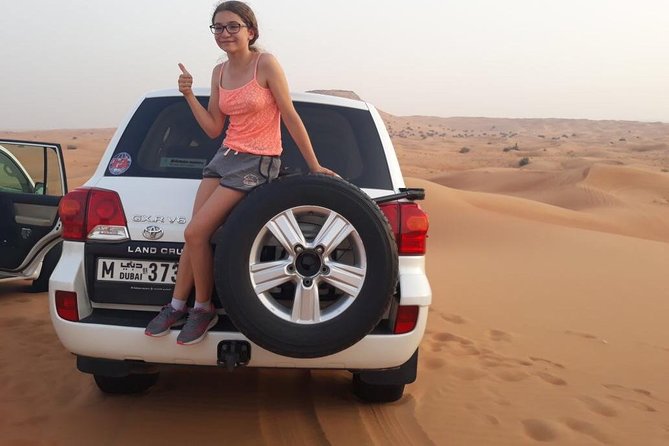 Desert Safari with BBQ Dinner (Sharing/Private) - Sandboarding adds a short burst of adventure