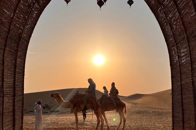 Desert Safari with Dune Bashing and Camel Ride plus Sand Boarding - Camel Riding, Sand Boarding, Henna, and Falcon Photos