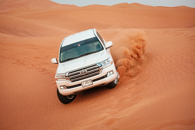 Desert Safari with Dune bashing BBQ Dinner and More Activities - Sandboarding and the first desert views