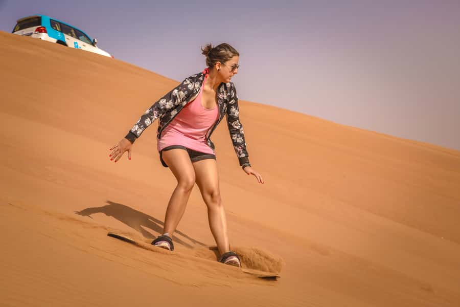 Dubai: Adventure Quad Bike Safari, Camel Ride & Refreshment - Sandboarding: simple, sandy, and surprisingly fun