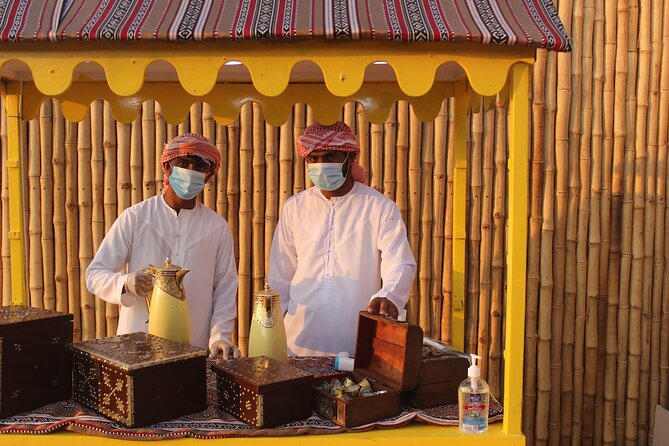 Dubai Afternoon Desert Safari and BBQ Dinner - Camel riding and sandboarding: fun, but brief