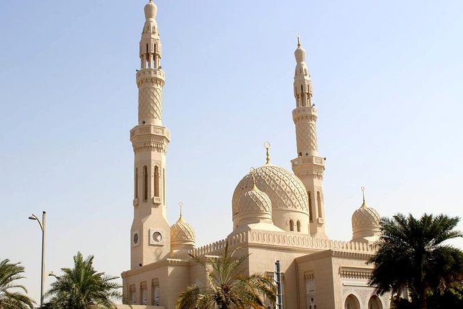 Dubai City Half Day Sightseeing and Landmarks Tour - The guide, vehicle, and shared-tour rhythm