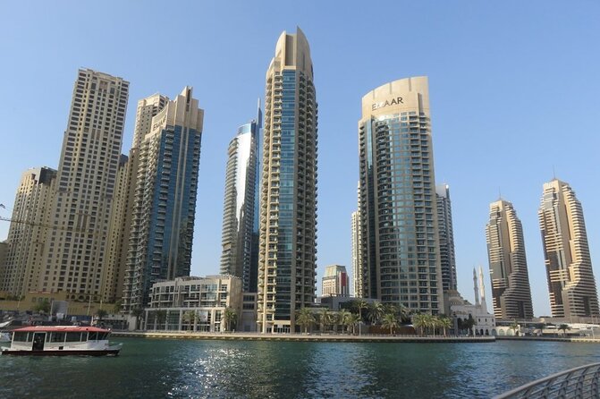 Dubai City Half Day Tour including Hotel Transfers - What the guide adds to the morning