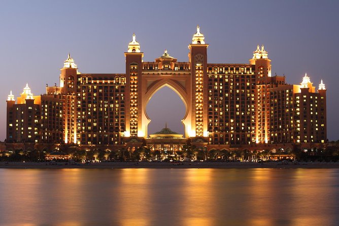 Dubai City Tour with Desert Safari, Camel Ride, Dune Bashing & BBQ - Camel riding and sandboarding