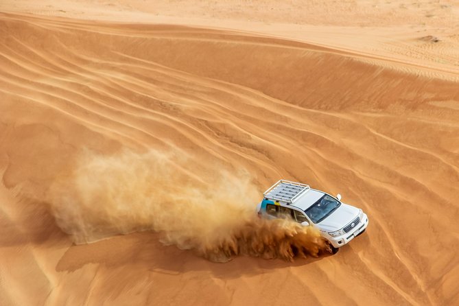 Dubai Desert 4x4 Dune Bashing, Sandboarding, Camel Riding, Dinner - Dinner beneath the Arabian sky