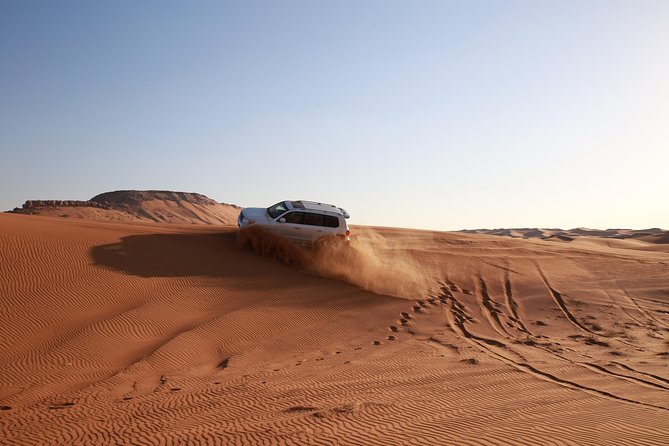 Dubai Desert Discovery: Red Dunes Safari, Sandboard & Camel Ride - Sandboarding for first-timers