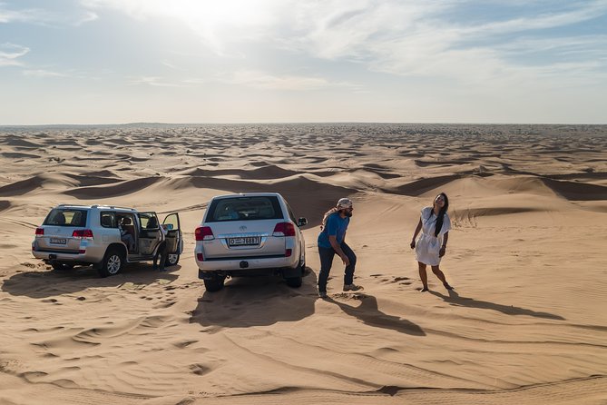 Dubai Desert Discovery: Red Dunes Safari, Sandboard & Camel Ride - Morning light or a desert sunset