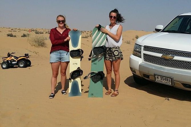 Dubai Desert Morning Tour in 4WD Vehicle: Camel Ride, Quad Bike Tour, Sandboarding, and Camel Farm - Quad biking across the sand