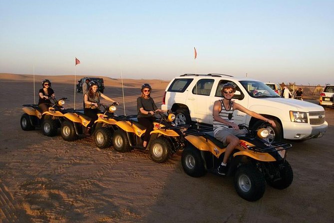 Dubai Desert Morning Tour in 4WD Vehicle: Camel Ride, Quad Bike Tour, Sandboarding, and Camel Farm - Sandboarding down the dunes