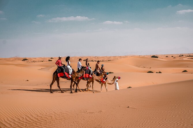 Dubai Desert Safari: Camel Ride, Sandboarding, BBQ & House Drinks - BBQ dinner, house drinks, and camp entertainment