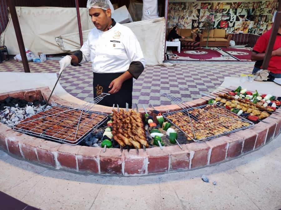 Dubai: Desert Safari Camel Riding, Sandboarding & BBQ Dinner - Sandboarding on the sandy slopes