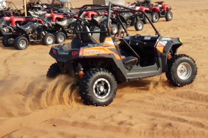 Dubai Desert Safari, Quad Bike, Camel Ride, and Buffet Dinner - Quad biking across the sand
