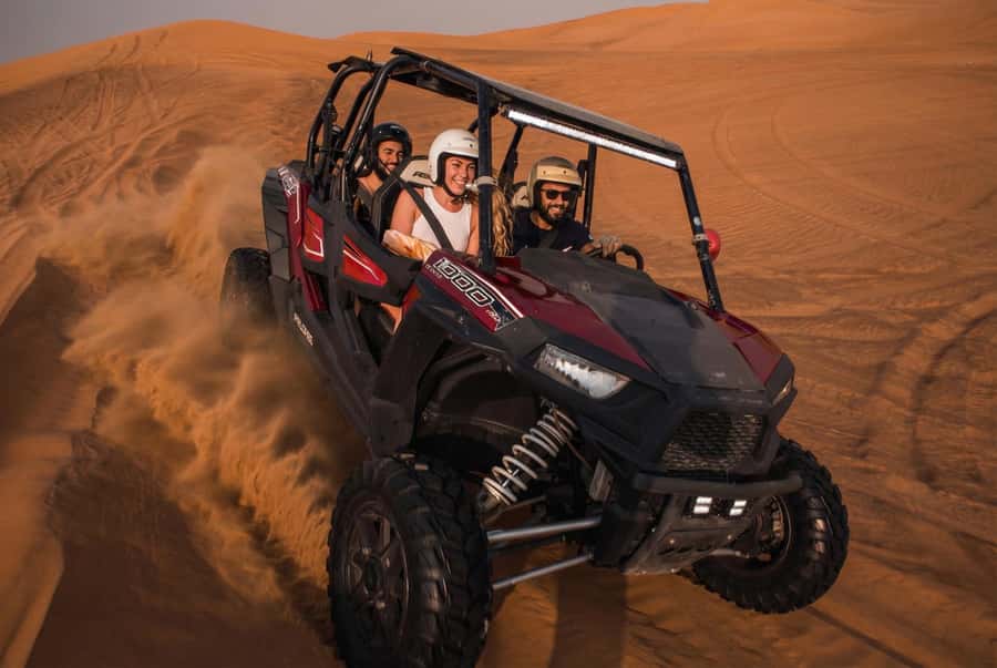 Dubai: Desert Safari, Quad Bike, Sandboarding, Camels & BBQ - Dune bashing across the red dunes